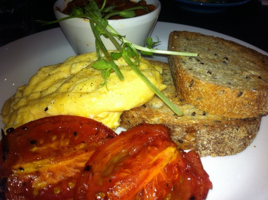 Diary free scrambled eggs on soy and linseed with grilled tomato and homemade beans 